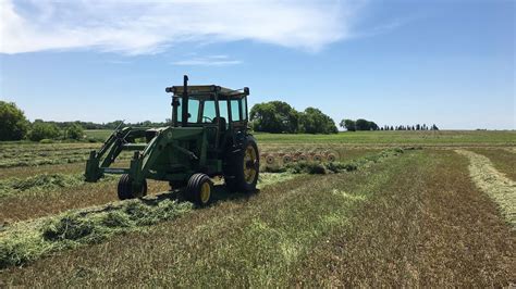 Raking and Baling First Cut Hay 2019 .